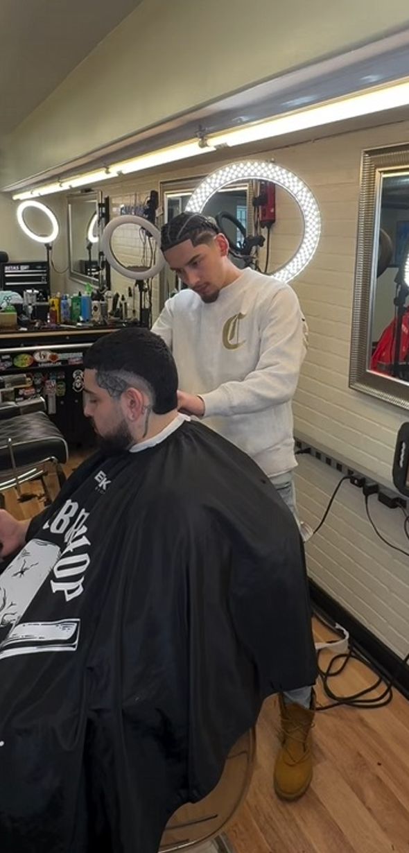 man cutting a clients hair